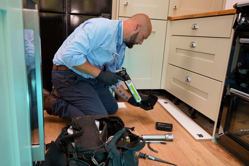 technician setting up mice bait